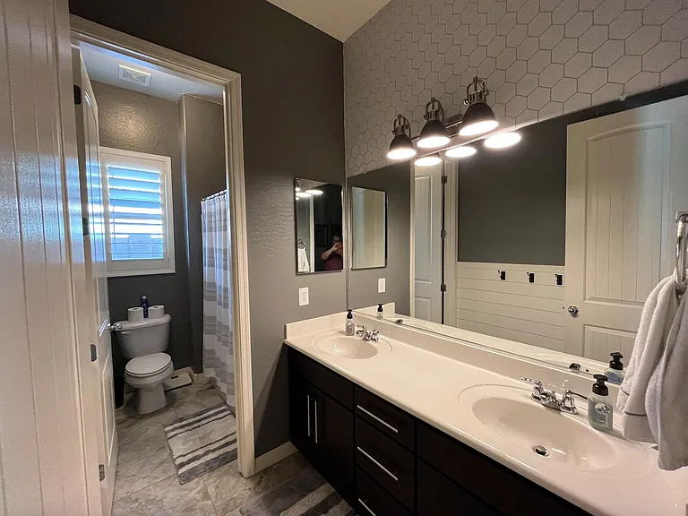 Bathroom that is between bedrooms 1 and 2 full bath and shower and double vanity