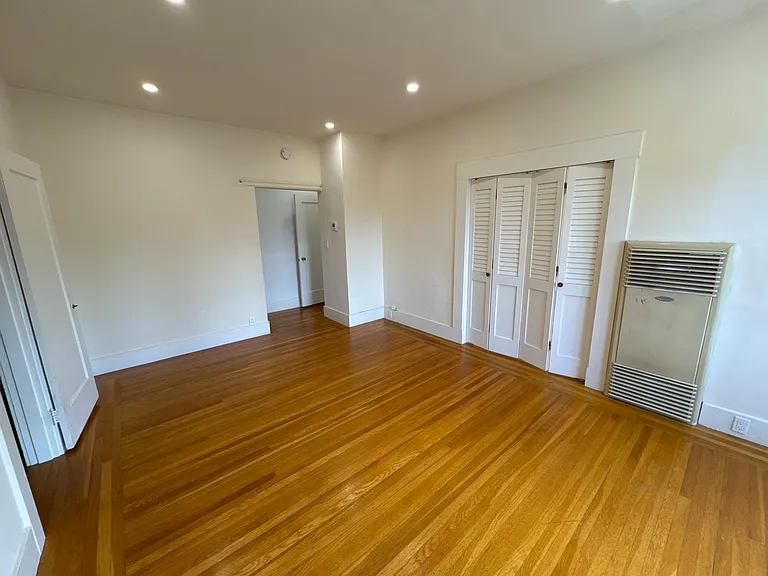 Living Room with folding doors leading to bedroom
