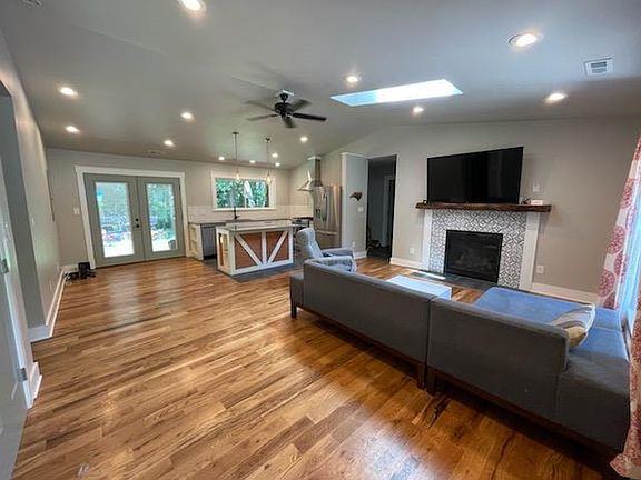 Open floor plan with space for dining area and french doors opening to back porch and private back yard.