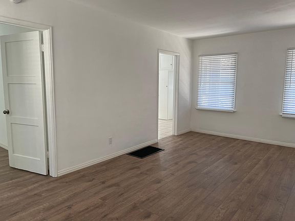Living room facing door to bedroom and kitchen