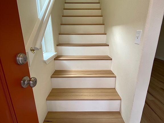 Front door opens to beautiful stairs