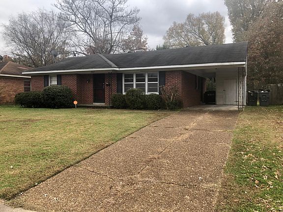 Front exterior with single car carport