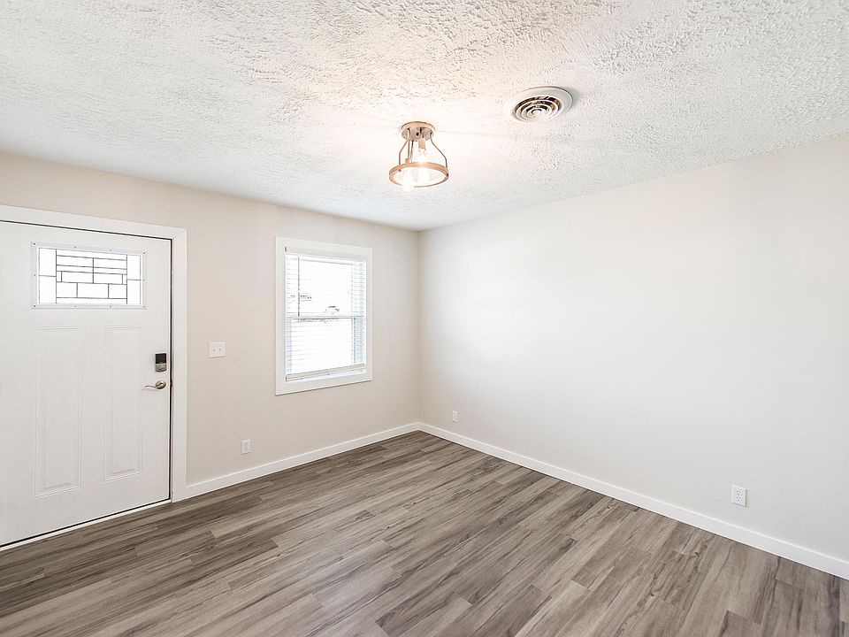 Living room from beside doorway into kitchen