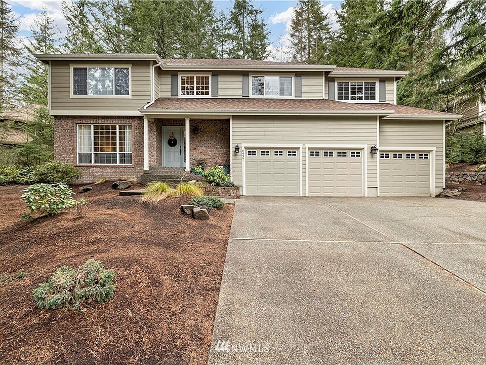Front view of home with three car garage