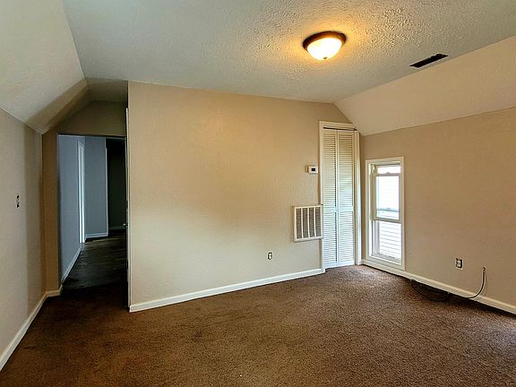 Living Room with Kitchen, Bathroom, Bedroom and Office in rear.