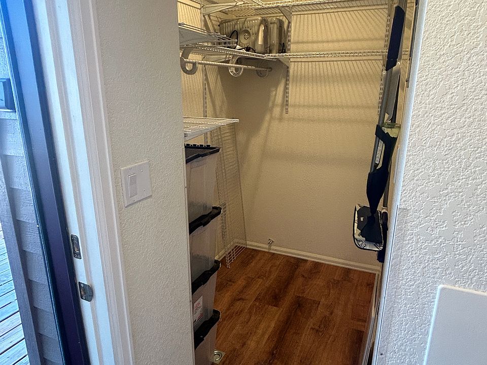 Large walk in closet with storage.
