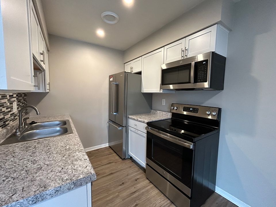 1 of 3 Kitchen options: White

includes: dishwasher, microwave, oven, and fridge.
