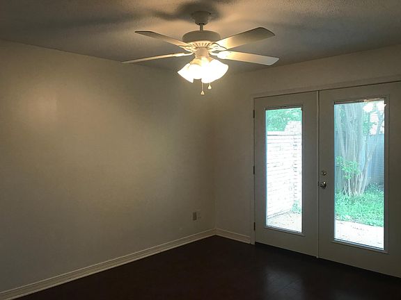 Downstairs bedroom with French doors to courtyard
