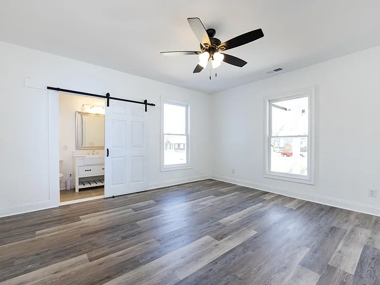Master bedroom with private bathroom. We kept some of the old parts of the house for character.