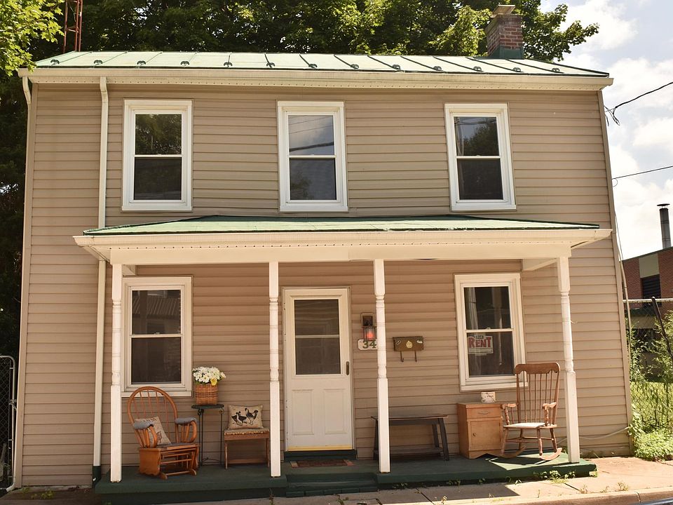 Charming front porch to sit and talk to friends.