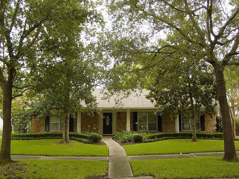 Home nestled amongst lush trees.