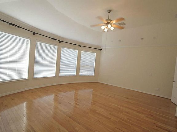 Master bedroom has curved windows.