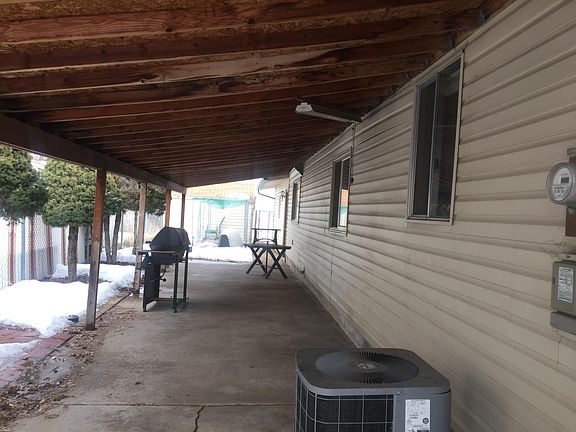 Coverred Cement patio in back of home all fenced,