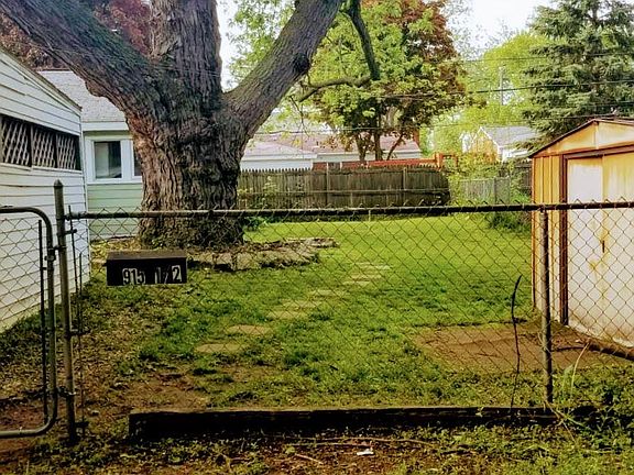 Fenced yard with storage shed