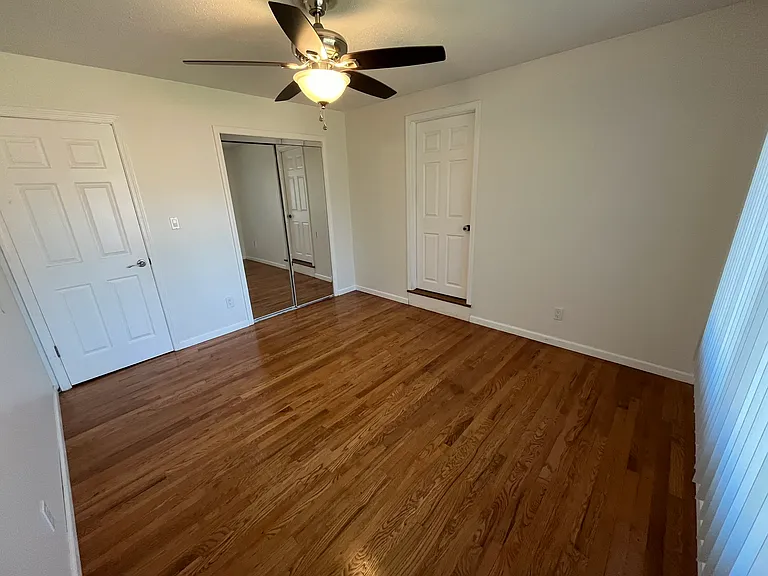 Mirror closets plus a NEW ceiling fan/light that matches 3 other rooms. Hardwood Oak is beautiful.