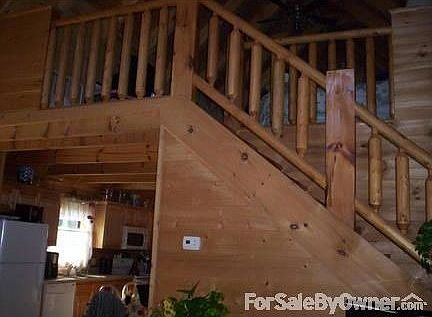 Staircase to Loft : Loft stays cool and has high ceiling...custom built-in storage!