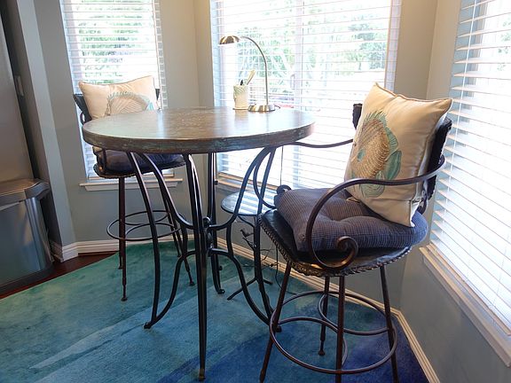 Breakfast nook doubles as a casual work area.