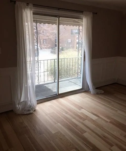 living room with a view of the balcony.