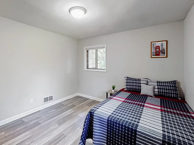 on the top floor, full-bed, reach-in closet space, with a room size of 11'6"x10'11" and a view of the backyard