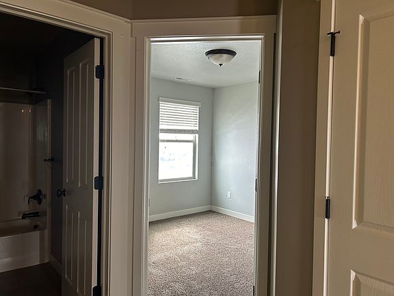 Guest bedroom with bathroom in the hall laundry in the hall