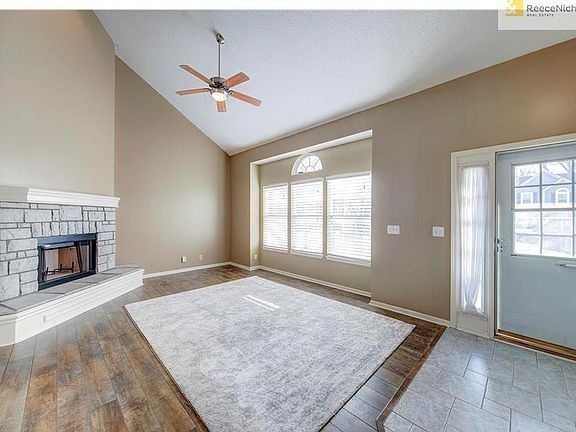 Step into the recently tiled entryway into a light and bright living area