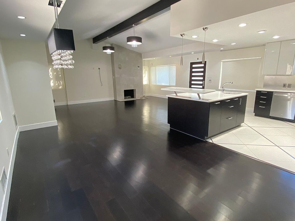 open floor plan, kitchen, dining, living area