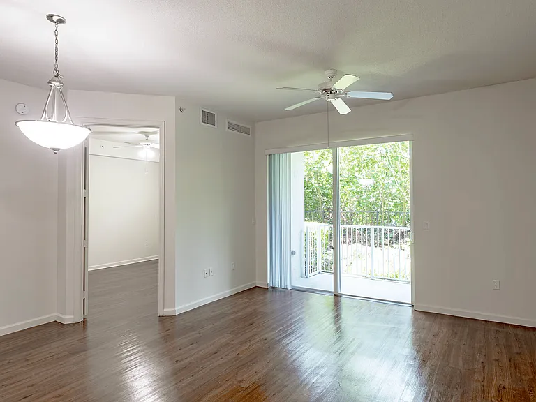 Bright and open living space with direct access to a private balcony.