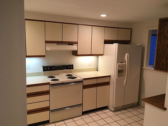 Electric stove with self cleaning oven, and ice maker fridge.