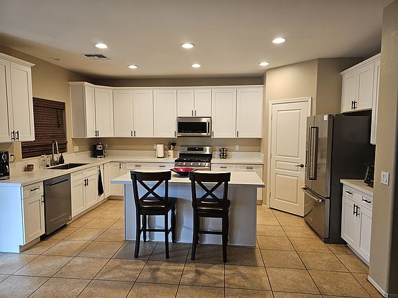 New Kitchen with Island. New Cabinets, New Quartz Counter tops, New Fridge, New Dishwasher and New Gas Stove with dual zone oven.
