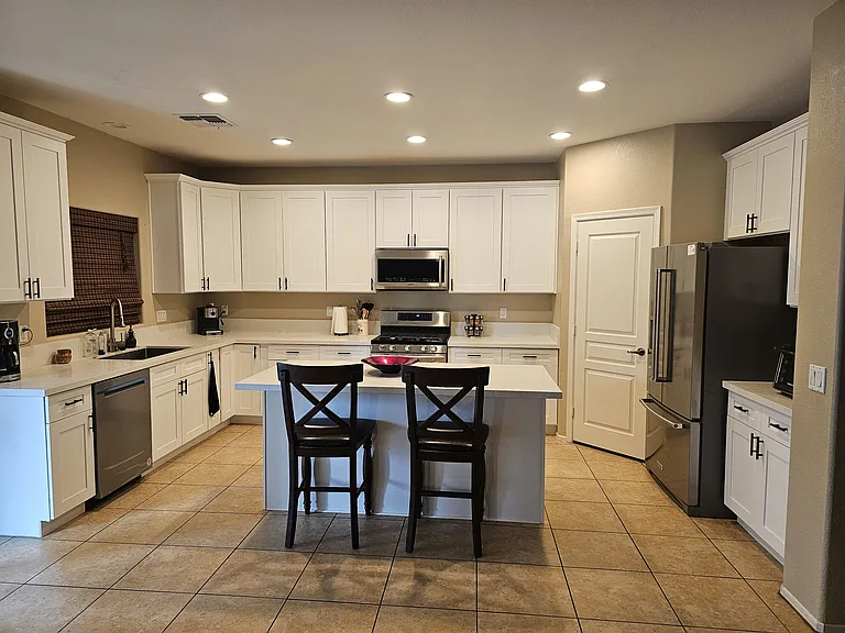 New Kitchen with Island. New Cabinets, New Quartz Counter tops, New Fridge, New Dishwasher and New Gas Stove with dual zone oven.
