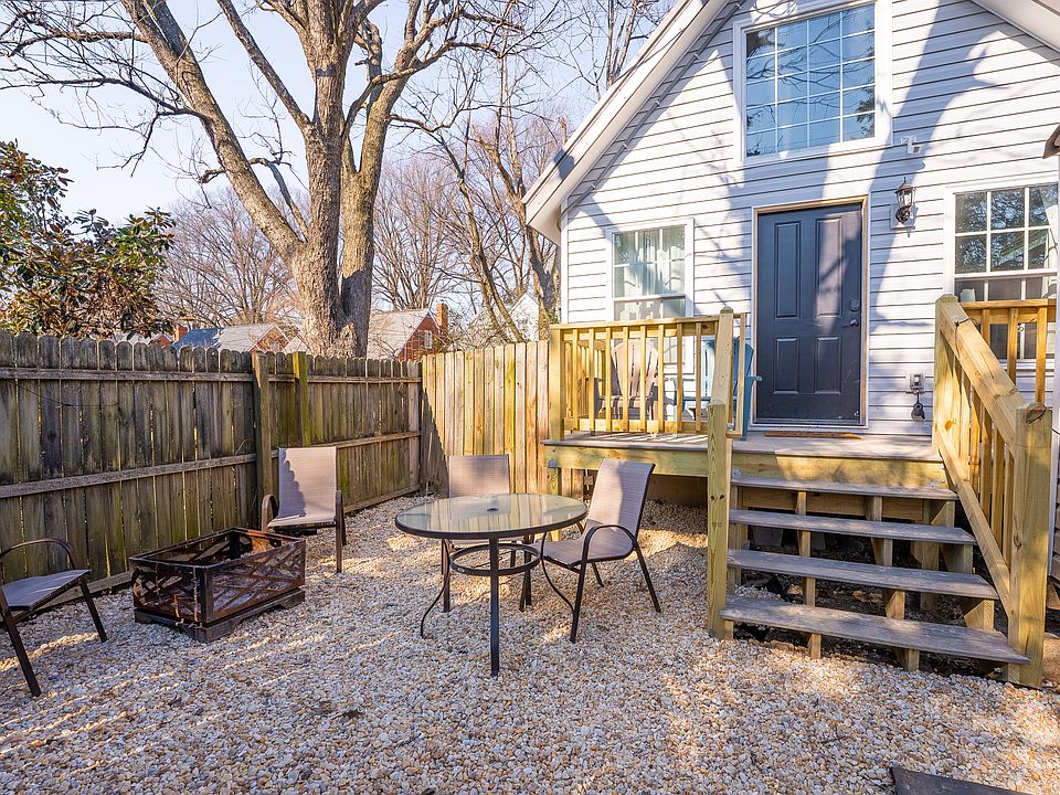 Your fully fenced and completely private yard/patio, complete with firepit, dining area, and deck!