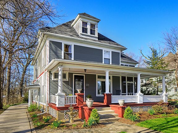A big wrap around front porch of your dreams, connected to the  screened porch, freshly painted.