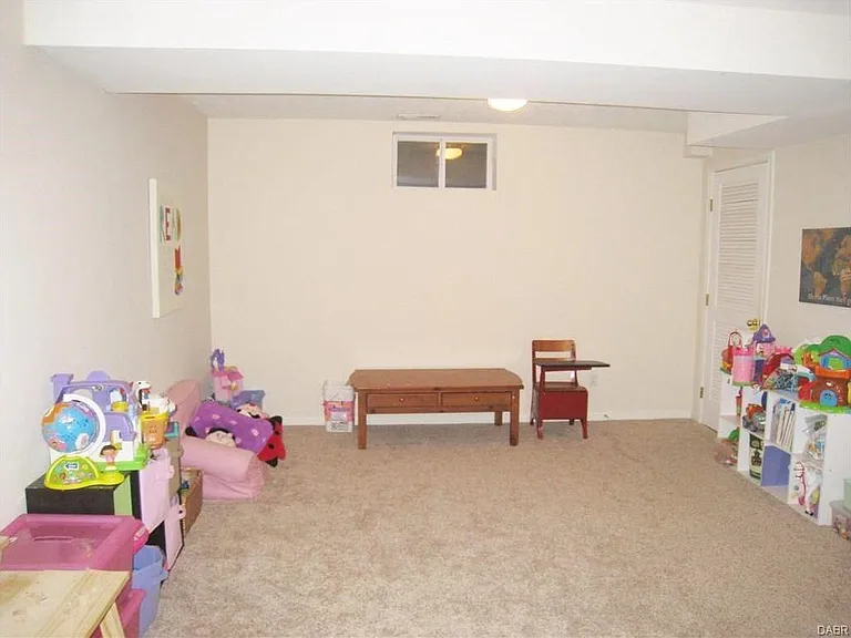 Huge basement! It's a great space for a den, playroom, fitness center, office, etc. There's additional storage space behind the door in the back on the right side.