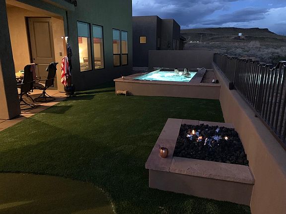 Pool, firepit, and putting green in the backyard. Very private as they back to the golf course!