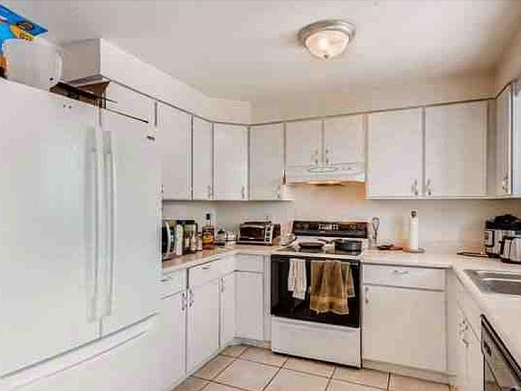 Bright kitchen with room for a table and chairs.