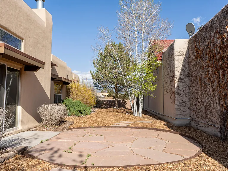 Yard with patio, fully fenced, on drip irrigation.