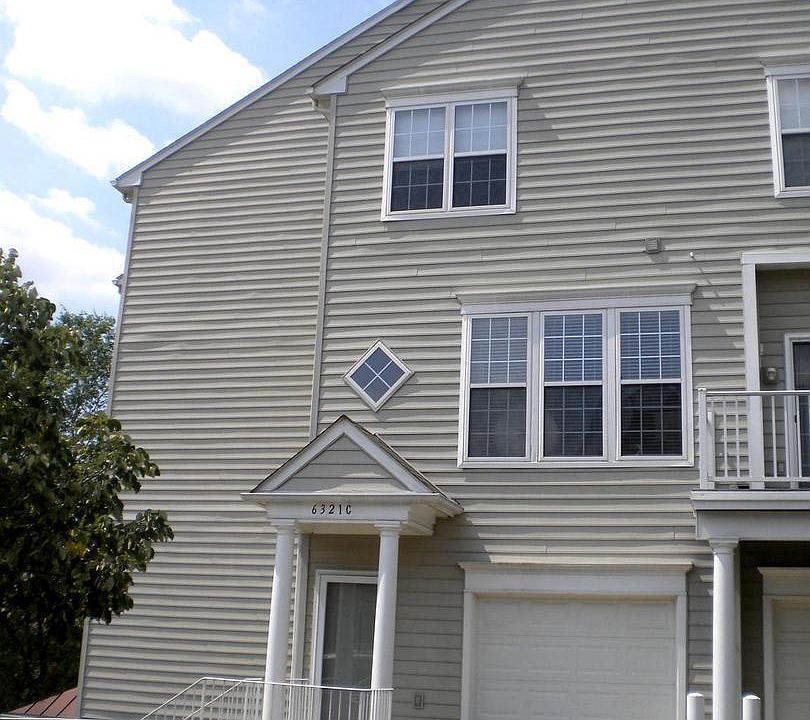Front door, garage, and driveway