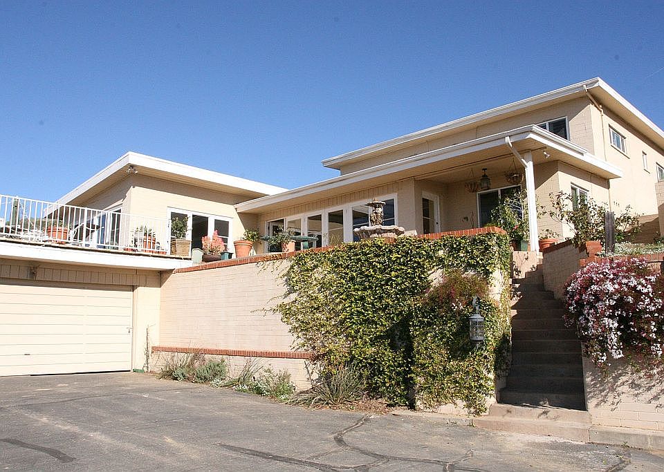 Front of house with deck and garage