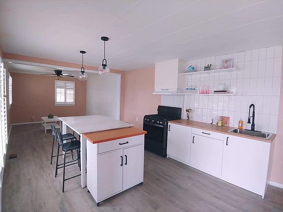 open concept kitchen with marble island/countertop table