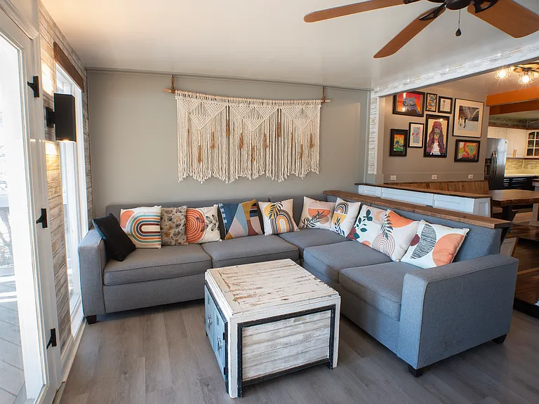 Sunroom with panoramic lake views, double french doors out to balcony, and dimmable lighting. Inquire about fully furnished option.