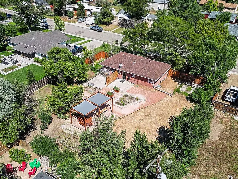 Space for an RV in the backyard or a kids ball kicking field!