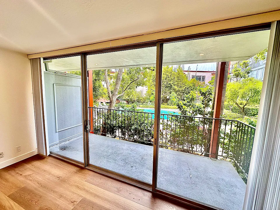 Unit #115 large private balcony overlooking the pool