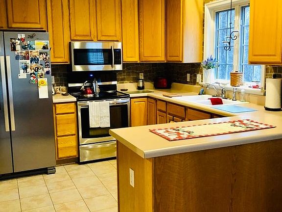 Kitchen includes Stainless Refrigerator, Microwave, Stove/Oven, Dishwasher
