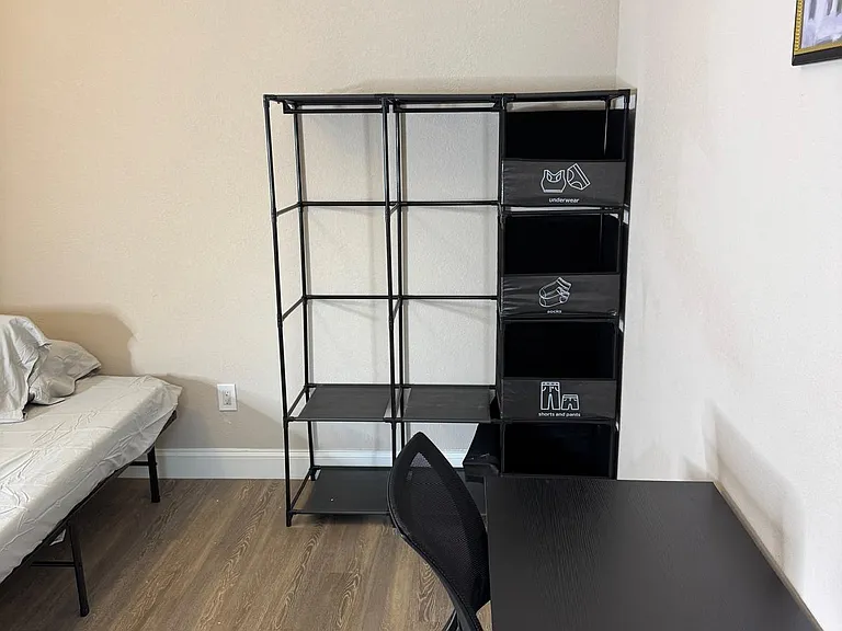 Fully furnished with a cozy bed, a sleek desk for work or study, and a roomy closet to keep everything organized.