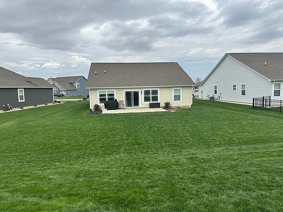 Walk out to a concrete patio for entertaining in the spacious backyard!