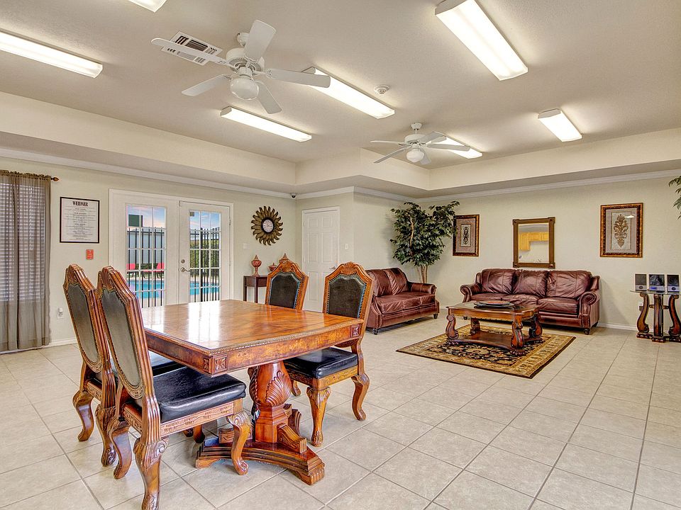 A shared space with tables and couches for resident use