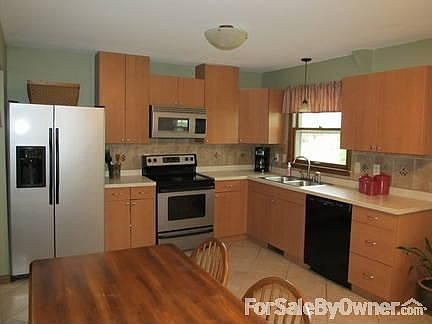 Kitchen (1of2) : All new...Tile Flooring, Stainless Steel Appliances(stay with home), Cabinets...