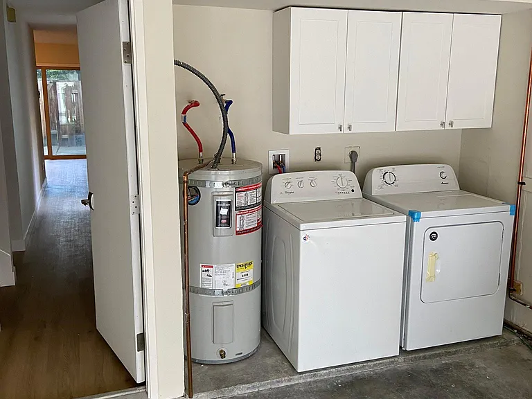Two garage with washer/dryer. Note: Can hook up EV in the garage to the dryer outlet.