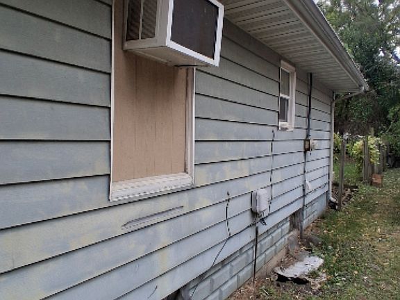 Siding and A/C unit
