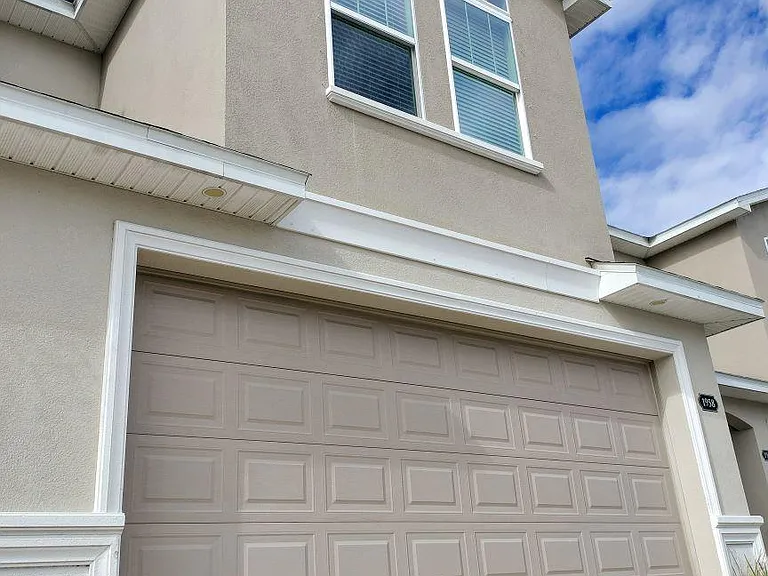 Front view with two car garage